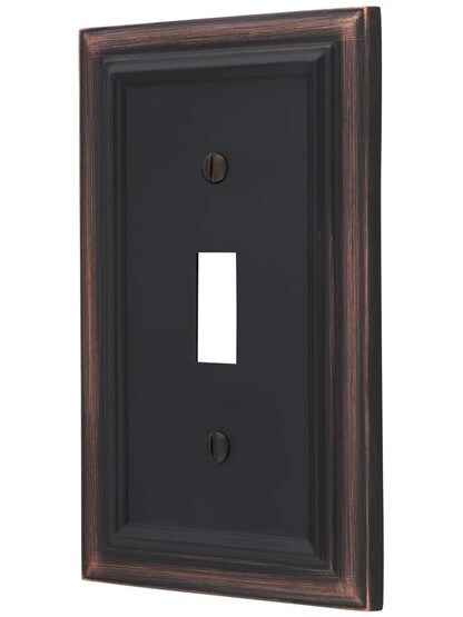 Georgian Single-Toggle Switch Plate in Aged Bronze.